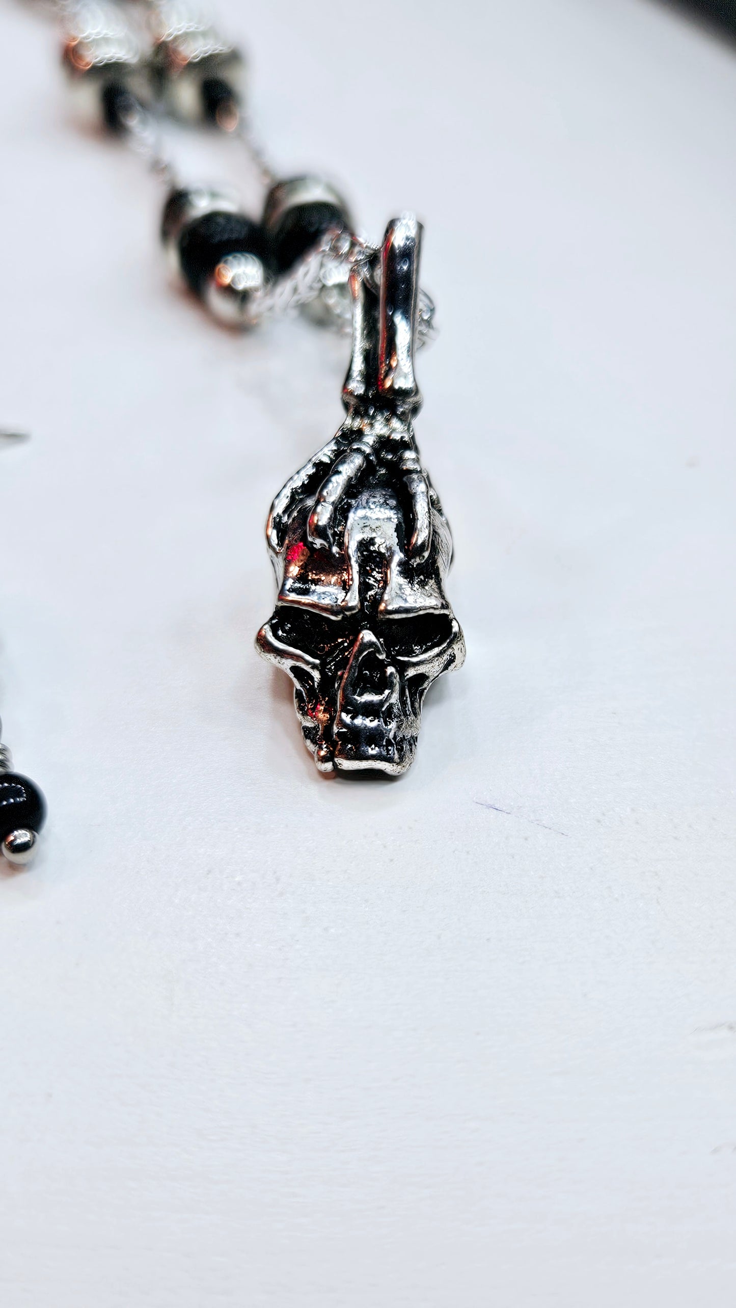 Black & Silver Skull Set: Skeleton Hand Gripping Skull Pendant Necklace with Black & Silver Beads, matching Earrings