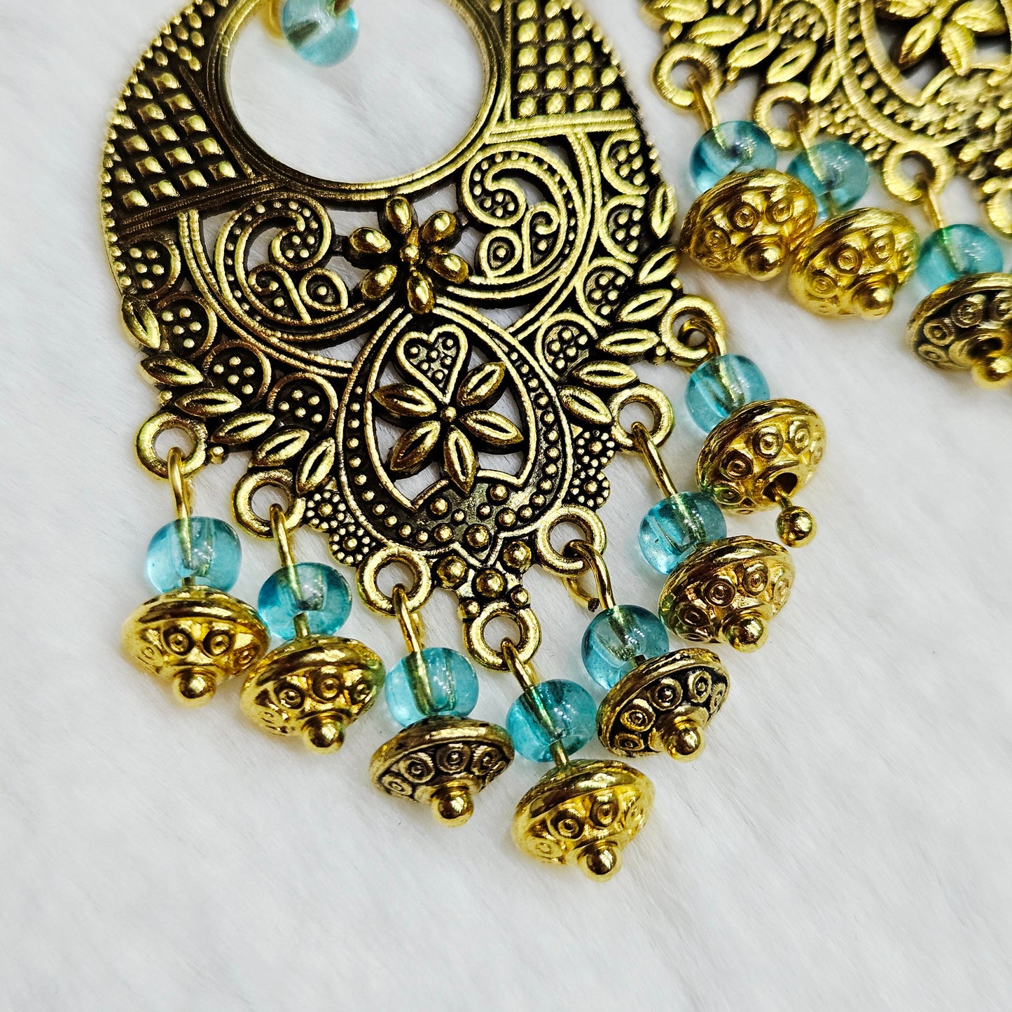 Bali Style Brassy-Gold Chandelier Earrings in Light Blue glass