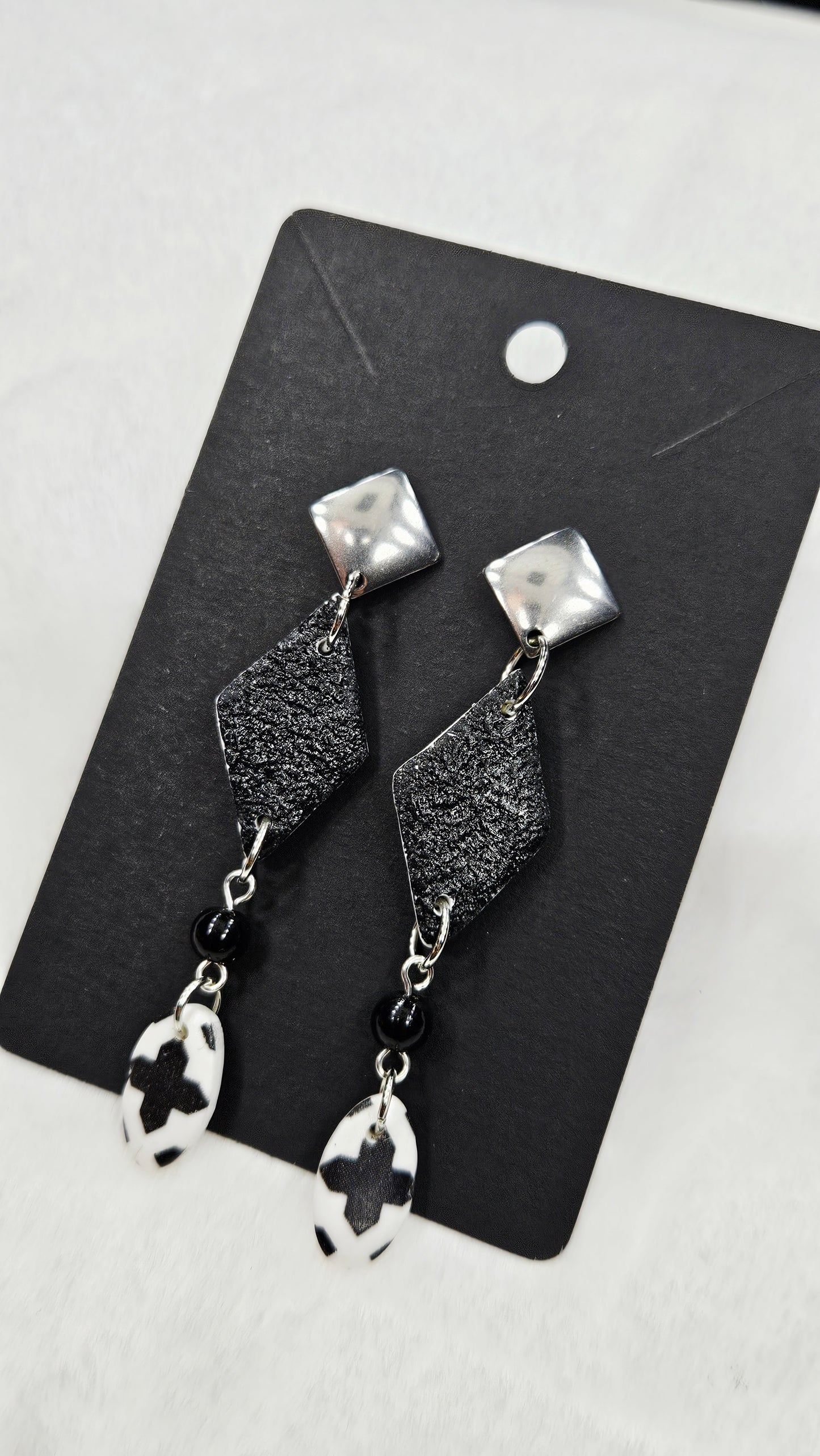 Monochrome Clay Black Kites Dangle Earrings with Cross Print Oval Buttons