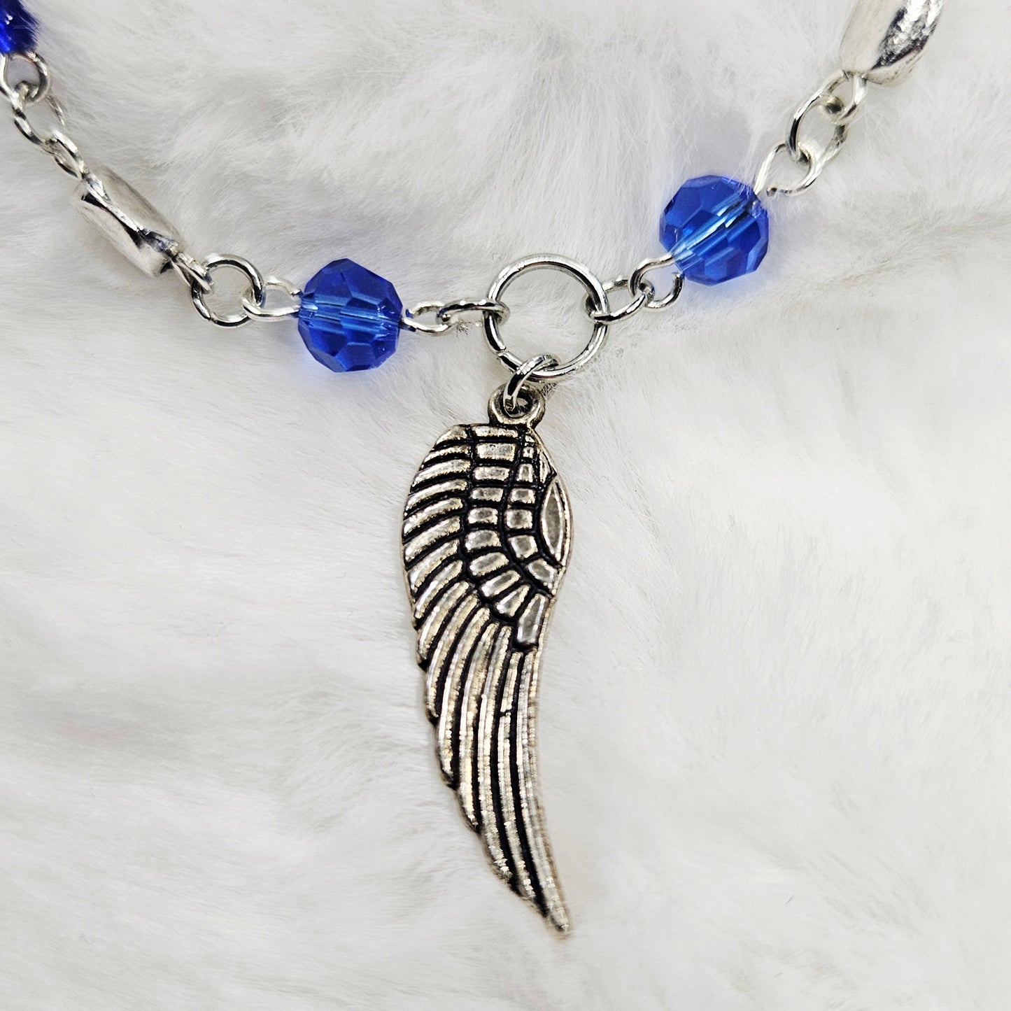 Silver Wing Charm Bracelet with Blue Crystals
