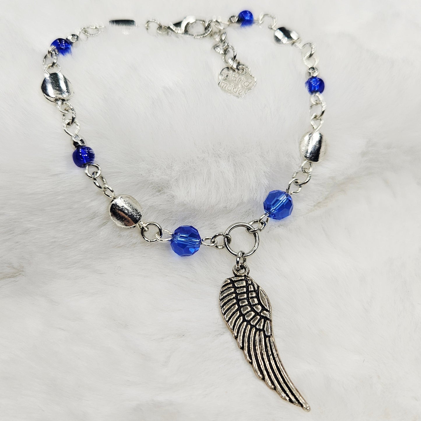 Silver Wing Charm Bracelet with Blue Crystals